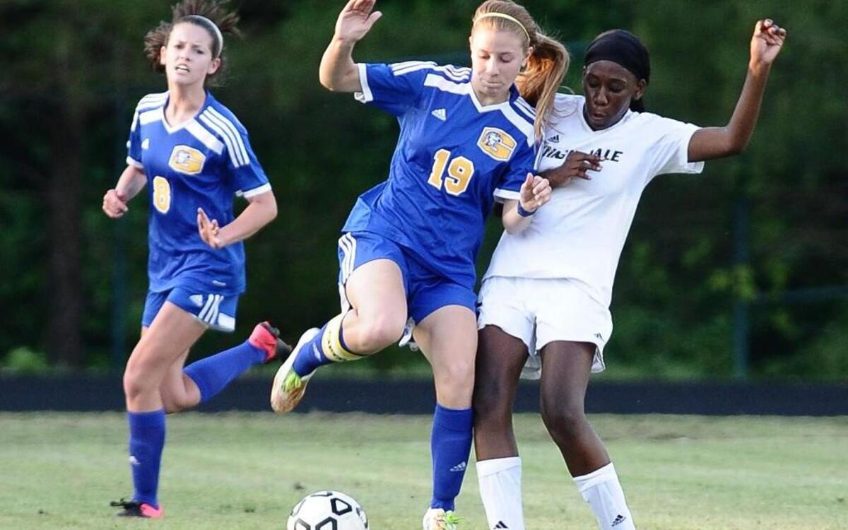 Knightdale's Leah Taylor Townsend (15) and Garner's Mikayla Marsich (19) battle for possession of the ball, during the 1st round of the NCHSAA 4A Playoffs. May 10, 2016 Knightdale Wins 4-0 in Knightdale, N.C. Damon Thomas.