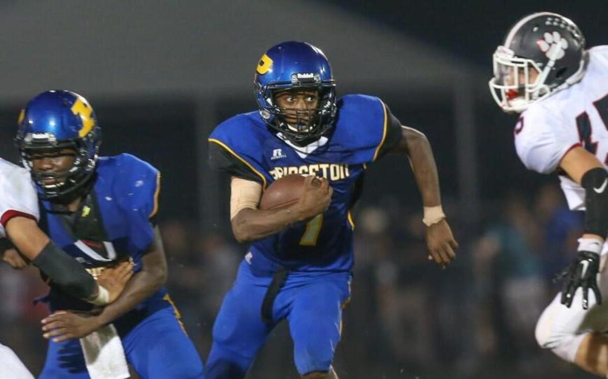Rahjai McPhatter (7) runs off his blocker as he picks up yardage down the middle. The North Johnston Panthers visited the Princeton Bulldogs in a high school football game on Sept. 22, 2017.