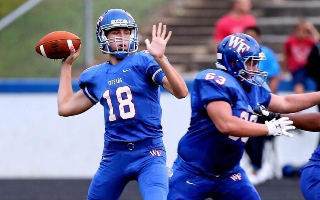 Wake Forest's Chris James (18) has all day to throw during the Southeast high school football game with Wake Forest high school in Wake Forest, N.C., September 9,2015. Wake forest leads at the half 38-0.