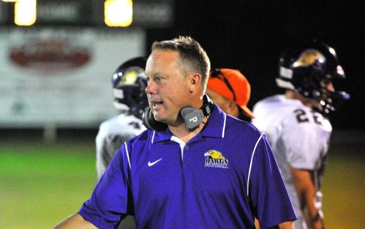 
Holly Springs head coach Wayne Bragg shakes hands after a 35-0 at Cary on October 10, 2014.
