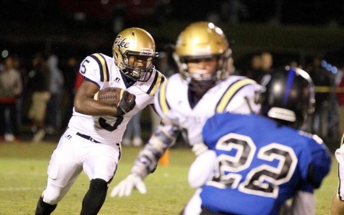 Fike's A.J. Jolly (5) running the ball during the second half of the Fike High School football game against Hunt High School in Wilson, N.C. on Friday, November 4, 2016.