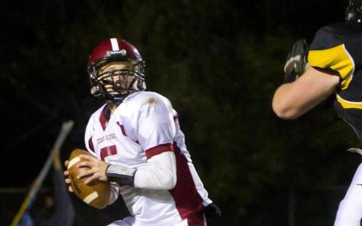 
Cedar Ridge quarterback Peyton Pappas gets lots of pressure from Chapel Hill’s Logan Tisch on Friday, November 8, 2013. Chapel Hill won 30-28. 
