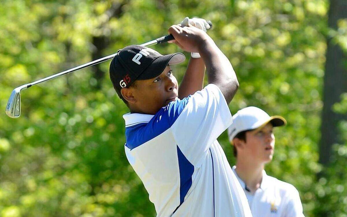 
Garner’s Jaylon Lynn tracks his tee shot on the par-4 No. 5 hole at River Ridge Golf Club during the Greater Neuse River 4A Conference match in Raleigh, N.C. on Thursday, April 23, 2015.

