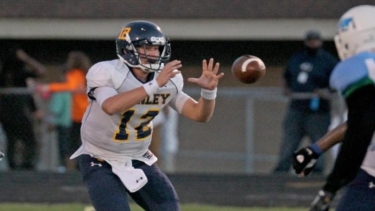 D.H. Conley quarterback Holton Ahlers (12) receives snap during the first half of DH Conley Varsity High School football game against JH Rose Varsity High School in Greenville, N.C. on Friday, September 23, 2016.
