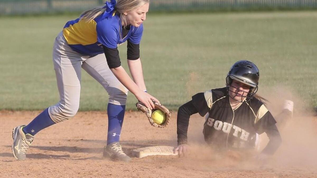 South Johnston's Carmen Keene (11) makes it safely to second on a stolen base as Princeton shortstop Hailey Woodall (2) covers the play. Coverage from the prep softball double header between the Princeton Bulldogs and the South Johnston Trojans played n Four Oaks, N.C. on Friday, March 17, 2017. South Johnston defeated Princeton 6-2 in the first game and 4-3 in the second game.