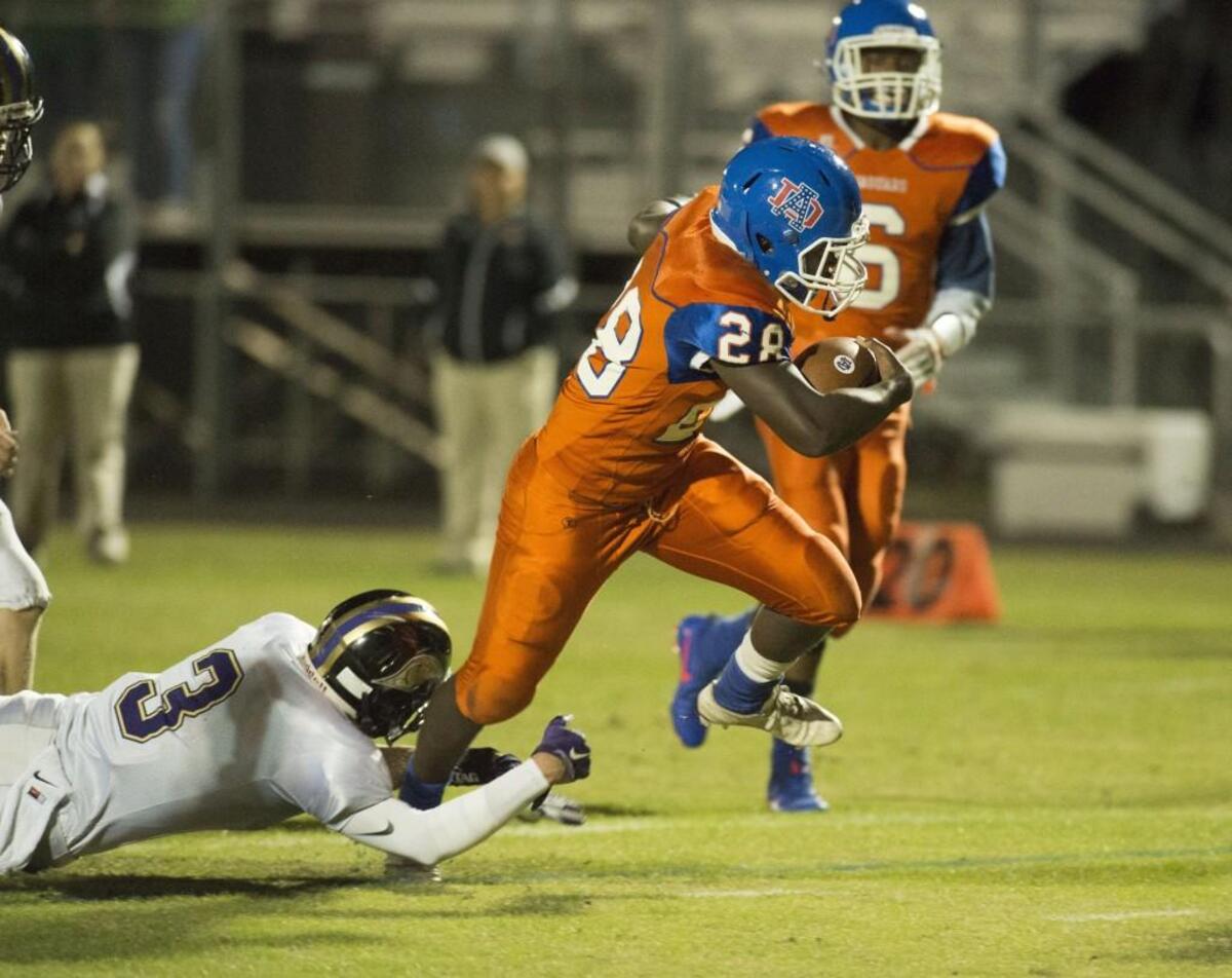 Athens Drive running back Isaiah Henderson (28) scores a touchdown on the opening drive during Southwest Wake 4A conference matchup between Holly Springs and Athens Drive that took place at Athens Drive High School on October 21, 2016 in Raleigh, North Carolina. Holly Springs defeated Athens Drive 3-2.
