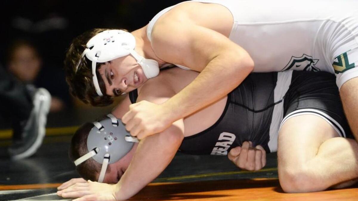Hunter Queen, right, of Northwood wrestles Gideon Biggs, left, of Morehead at the 160 lbs weight class during the Tiger Holiday Classic Wrestling Tournament that took place at the Chapel Hill High School in Chapel Hill, N.C. on Wednesday, December 23, 2015.