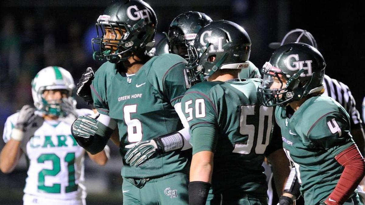 
Green Hope celebrates the first-half touchdown by Bryce Dixon (6) during the football game in Cary on Friday, September 27, 2013. Green Hope led 6-0 at the half.
