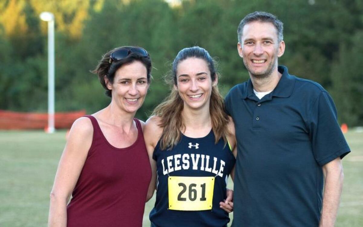 Leesville Road's Nevada Mareno with mom, Janice, and dad, Jason during Cap-8 Cross Country Track and Field meet that took place at Wake Med Soccer Park on October 18, 2016 in Cary, North Carolina.
