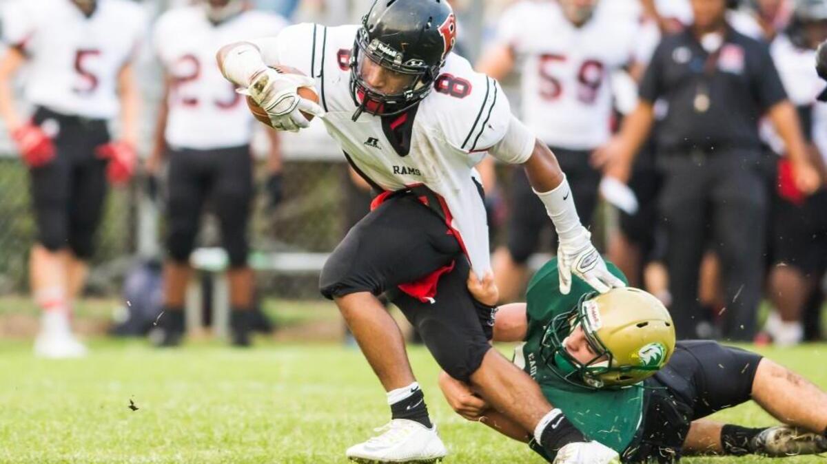 
Rolesville’s Josh Branch (8) breaks a tackle from Enloe's Ian Tisdale (31) during a football game played on Thursday, September 03, 2015. Rolesville won 34-6.
