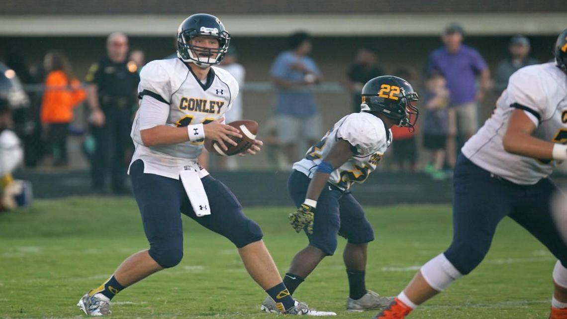 D.H. Conley quarterback Holton Ahlers steps back to pass during the Vikings' game against the J.H. Rose Rampants in Greenville, N.C. on Friday, September 23, 2016.