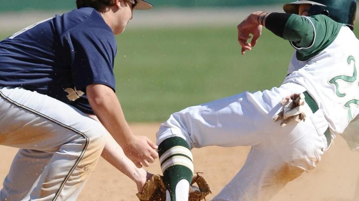 South Johnston's Noah Bridges slides into second base and into Smithfield-Selma's Corey Branch.