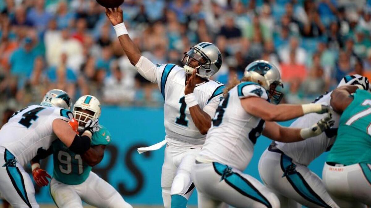 
Carolina Panthers quarterback Cam Newton, who walked with a slight limp along the sideline in the second half, went 4-for-10 for 42 yards and an interception that was nearly a touchdown. The Panthers won, 31-20, over the Dolphins on Saturday night.



