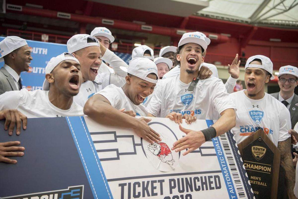 Members of the Gardner-Webb basketball team celebrate winning the Big South tournament championship and making their first NCAA tournament ever on March 10th.