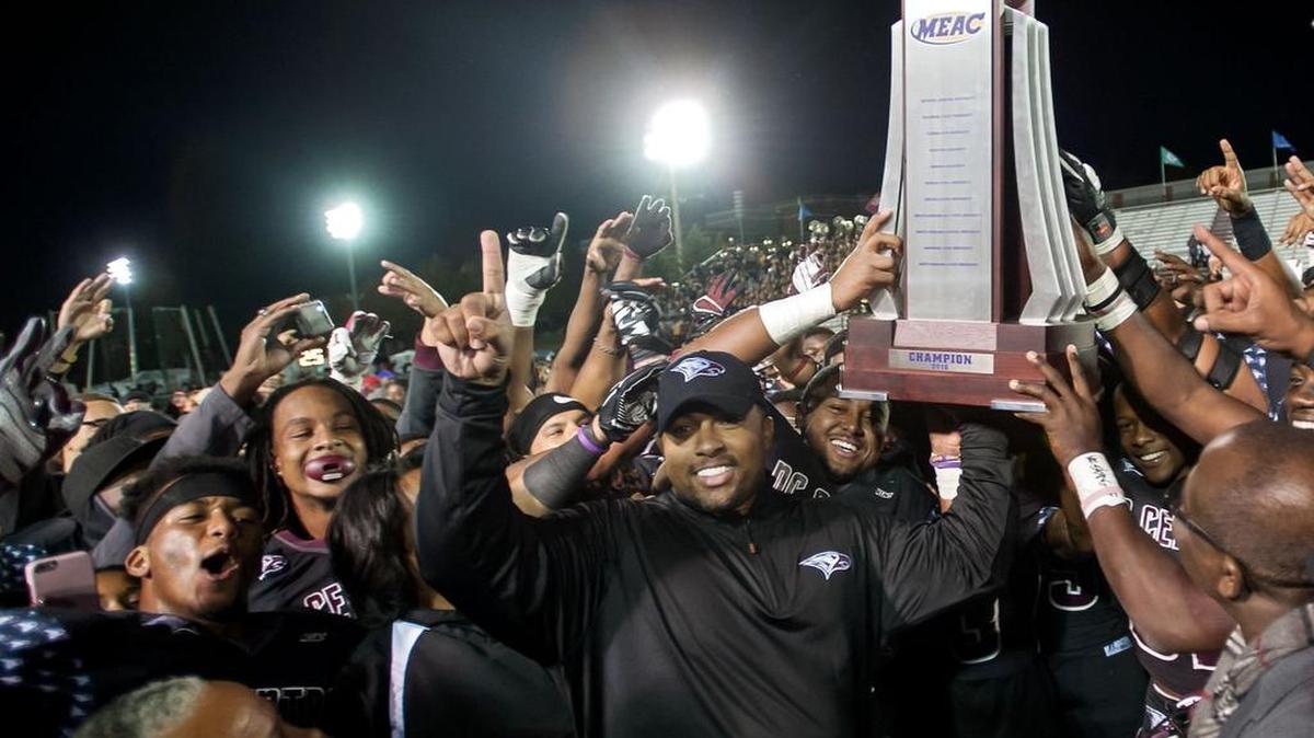 N.C. Central coach Jerry Mack (center) celebrates with his team after winning their third MEAC title in a row last season. The Eagles were picked to win their fourth straight title on Friday during the MEAC Media Day festivities in Norfolk, Virginia.