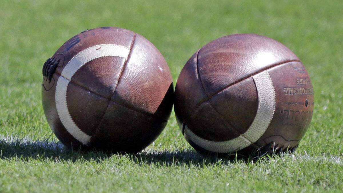 Footballs on a field