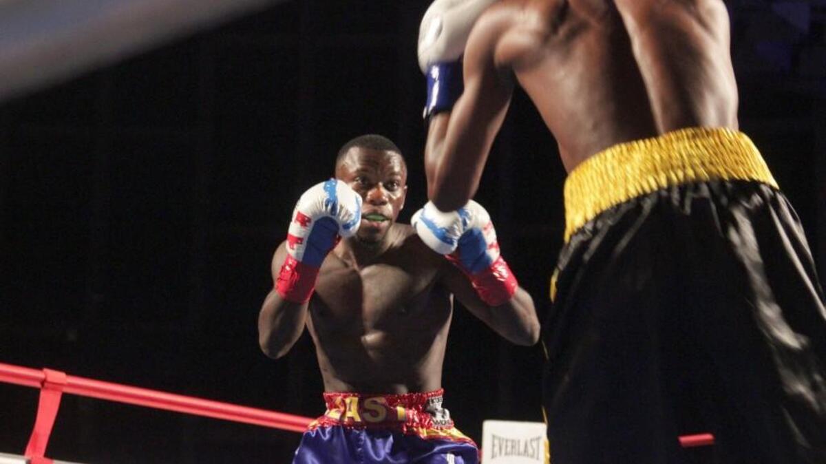 Dewayne Beamon and Rudolph “The Cutting Edge” Hedge square up at Friday night’s boxing match in Dorton Arena on May 13, 2016.