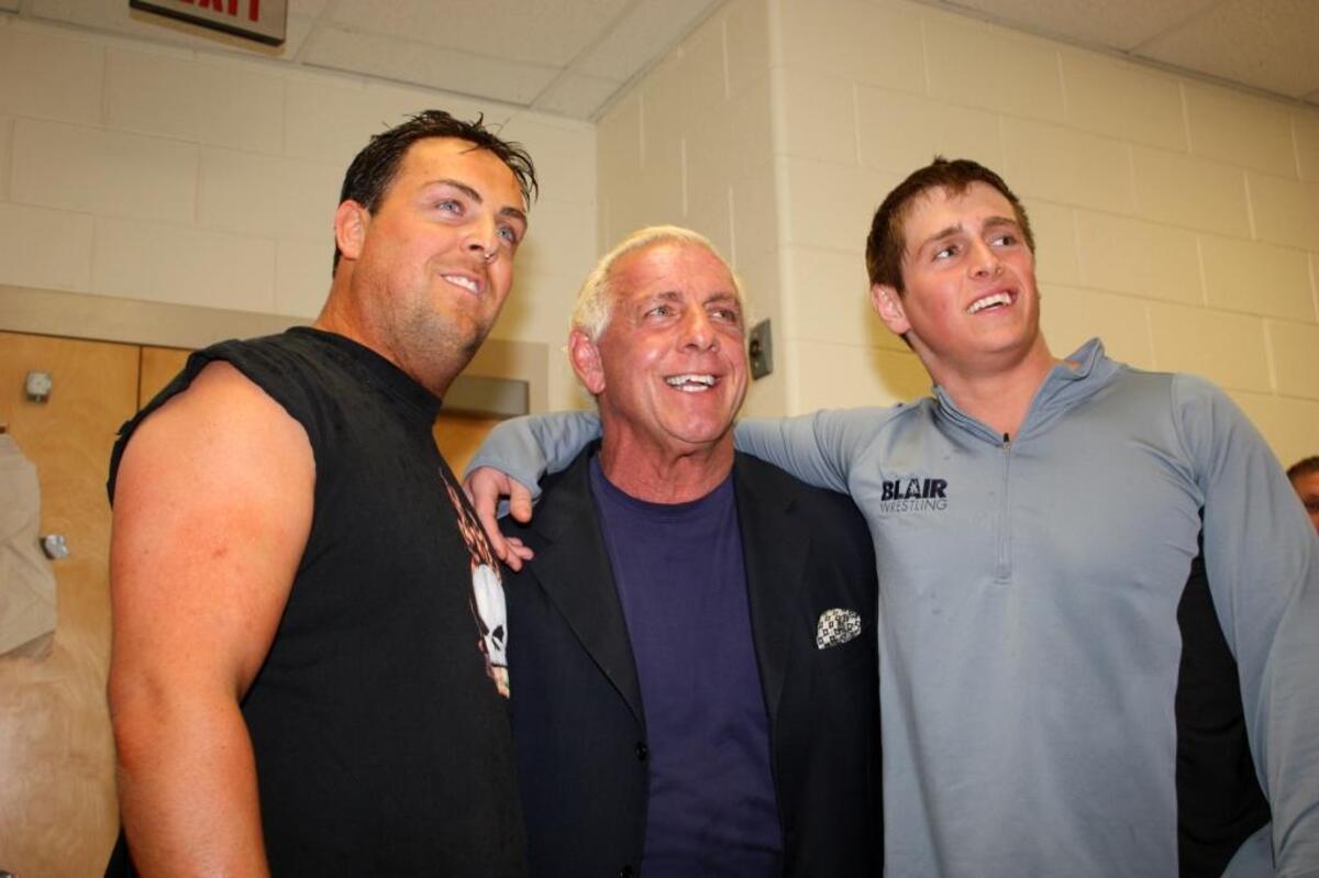 A December 2008 photo shows Reid Flair with his father, Ric, and brother, David, prior to Reid’s debut match in Charlotte.