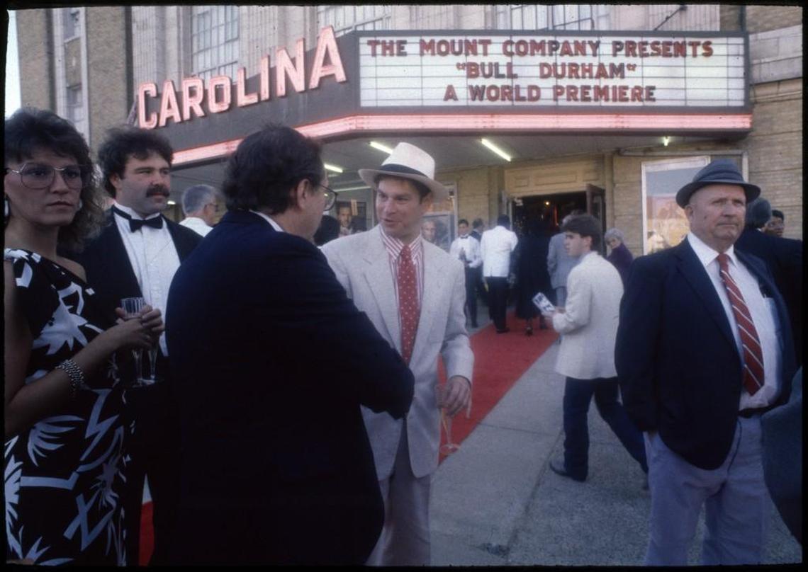 "Bull Durham" cast member Robert Wuhl, center, attends the premiere at the Carolina Theatre in Durham.