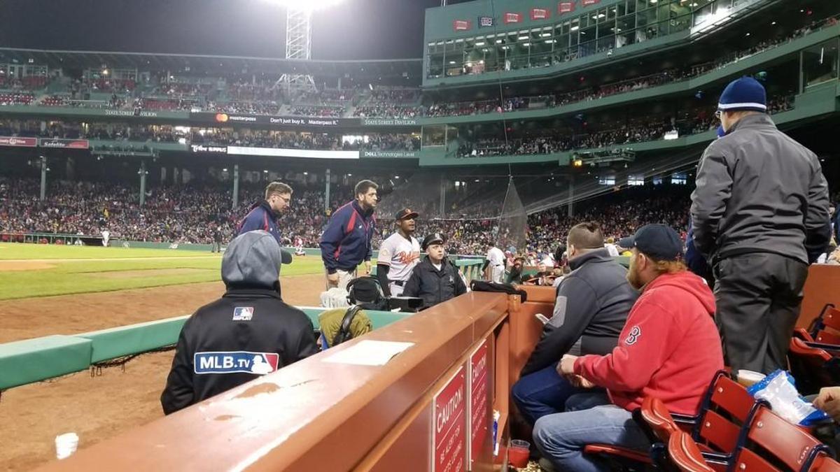 In this photo provided by Avi Miller, security watches after Baltimore Orioles center fielder Adam Jones was taunted by racial slurs at Fenway Park in Boston, Monday, May 1, 2017. (Avi Miller via AP)