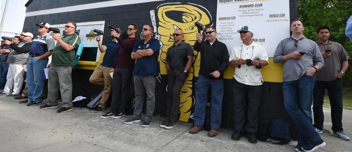 Professional baseball scouts crowd behind home plate at Fairmont High School where MLB prospect MacKenzie Gore of Whiteville pitched his team to a 19-0 win in Fairmont, N.C., Thursday, May 4, 2017.