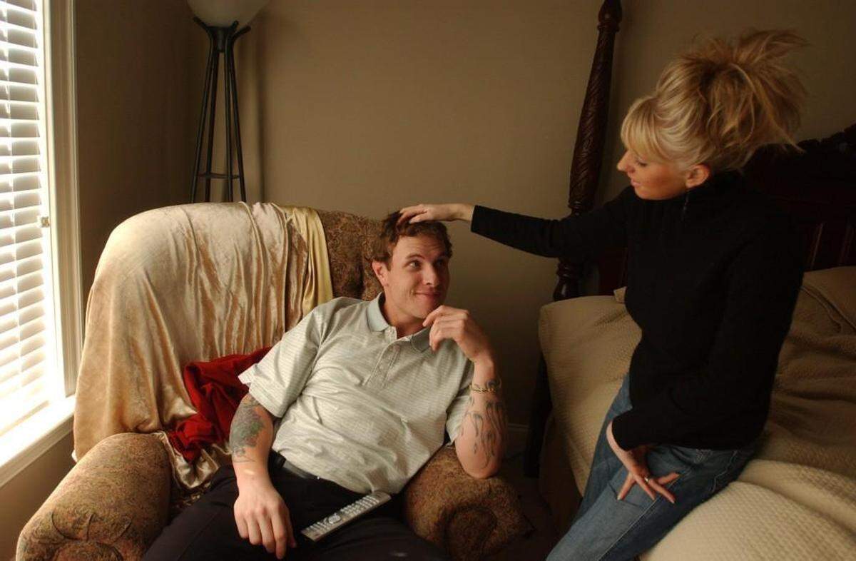 “Your hair looks good,” says Katie Hamilton as she runs her fingers through husband Josh Hamilton’s hair in Fuquay-Varina shortly after their marriage in 2004.