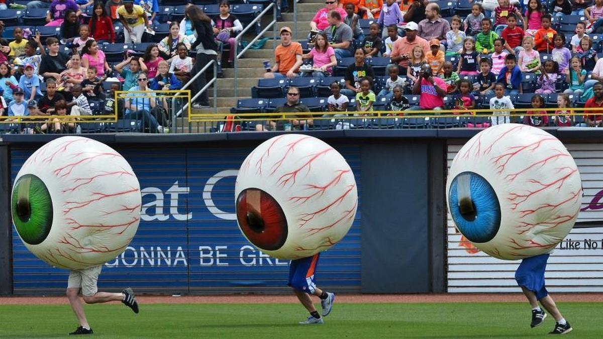 Several thousand school children from around the Triangle watched as members of the Durham Bulls promotion team perform the "Laser Eye Care Center Eyeball Race" on May 8, 2013 in Durham. Dancing eyeballs are not a feature of Buies Creek Astros games.