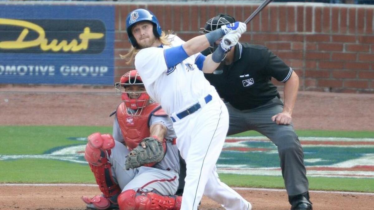 Durham’s Taylor Motter hits the ball in front of Syracuse Chiefs’ catcher Pedro Severino on July 4. Motter has played all nine positions this season.