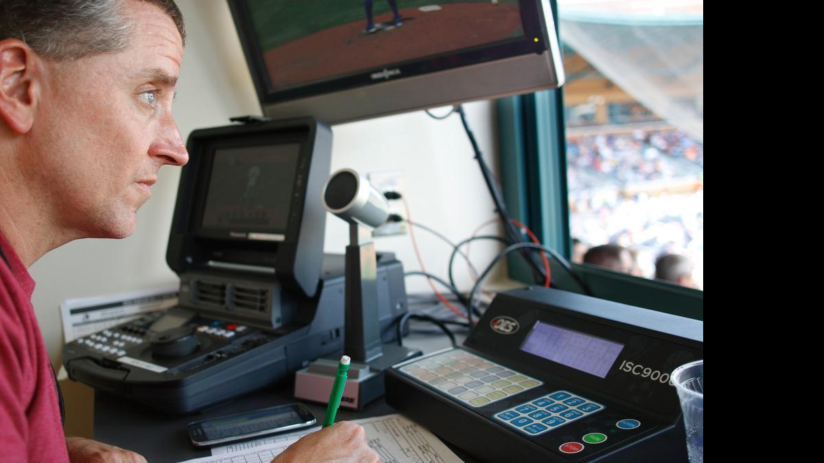 
Brent Belvin watches the game while keeping track of the count in Durham, NC on Wednesday, June 24, 2015 at Durham Bulls Athletic Park. Belvin has been scorekeeping for the Durham Bulls for 27 years.

