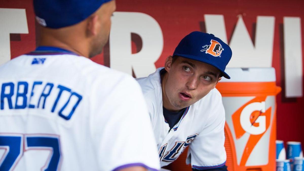 
Durham Bulls Pitcher Blake Snell talks with fellow pitcher Jordan Norberto from the dugout during the game against the Gwinnett Braves on Friday, July 31, 2015 at Durham Bulls Athletic Park.
