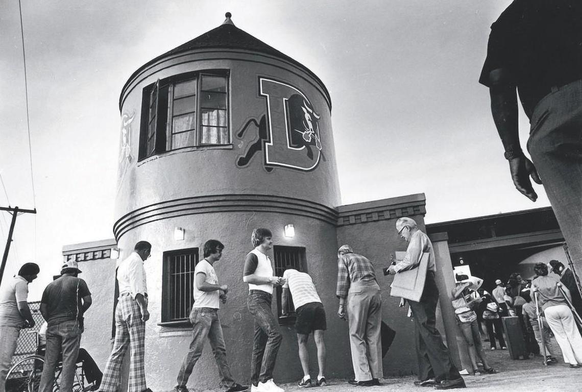 Customers buy tickets to enter the old home of the Durham Bulls, Durham Athletic Park, in 1980.