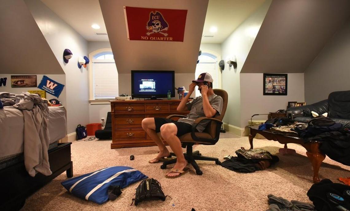 MacKenzie Gore speaks to a friend about his final home game in his bedroom at his home in Whiteville, N.C., Saturday, May 13, 2017.