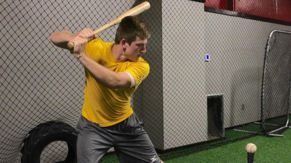 East Carolina freshman and Holly Springs Salamanders catcher Jake Washer prepares to take a swing during batting practice on Tuesday, June 28. Washer is among three ECU players starring for the Salamanders this summer.