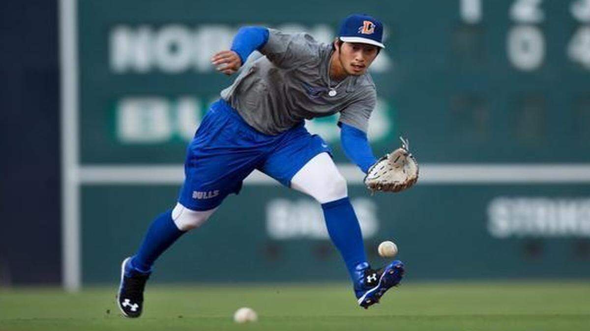 
Shortstop Hak-Ju Lee fields a ball during evening practice at the Durham Bulls Athletic Park on Tuesday, April 7, 2015 in Durham, N.C. The Bulls begin their season with an away game against the Gwinnett Braves on Thursday, April 9, 2015. The team will play at home for the first time on Wednesday, April 15, 2015 against the Norfolk Tides at 6:05 p.m.
