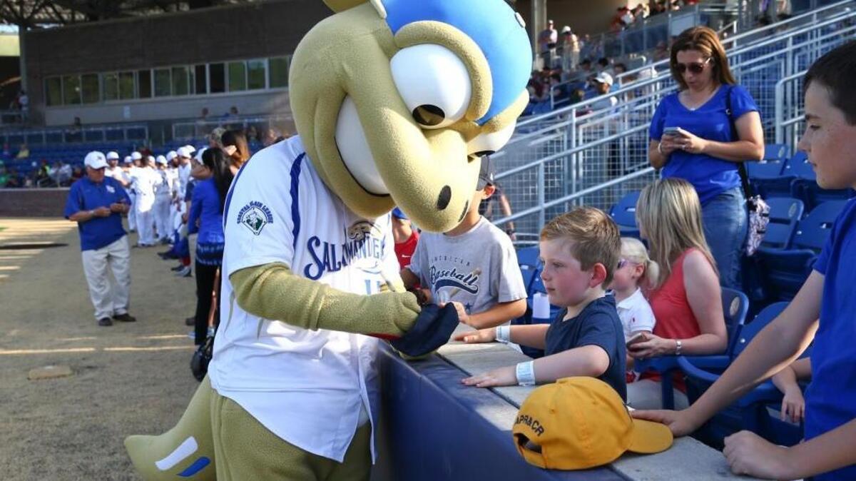 Sal the Salamander signs autographs before last year’s inaugural Holly Springs Salamanders game.