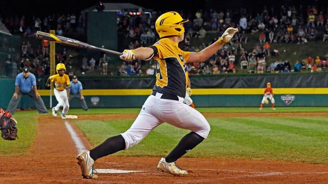 Greenville, N.C.'s Thomas Barrett drives in the winning run from third during the seventh inning against Lufkin, Texas.
