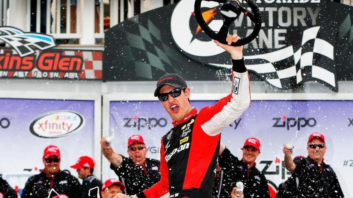 
Joey Logano celebrates after winning his first road-course race at Watkins Glen International.
