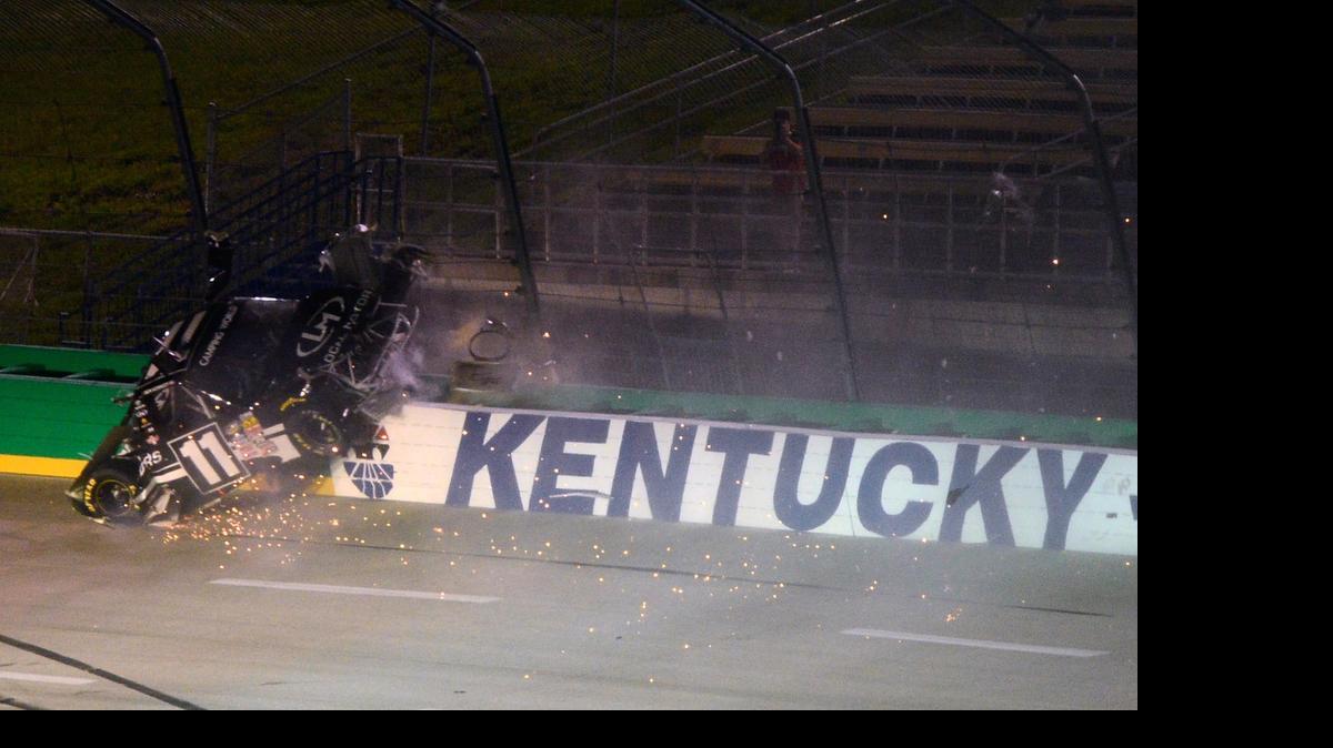 
Ben Kennedy crashes into the fence and wall during the NASCAR Camping World Truck Series UNOH 225 at Kentucky Speedway on Thursday, July 9, 2015 in Sparta, Ky.
