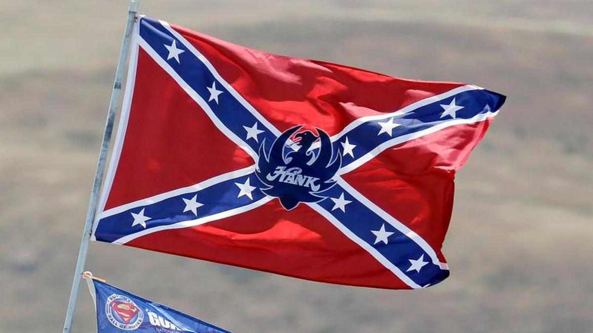 
A number of flags, including a Confederate themed one, fly atop RV's in a campground outside the track during practice for the NASCAR Sprint Cup Series auto race Friday, June 26, 2015, in Sonoma, Calif. 
