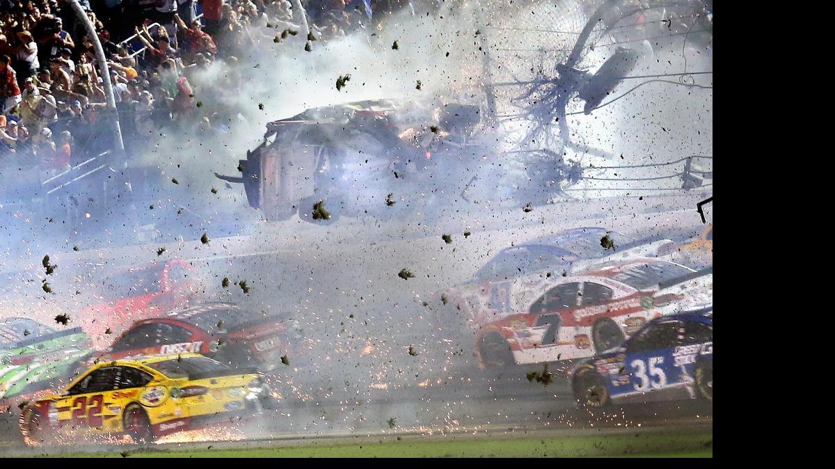 
Austin Dillon (3) goes airborne and hits the catch fence as he was involved in a multi-car crash on the final lap of the NASCAR Sprint Cup series auto race at Daytona International Speedway, Monday.
