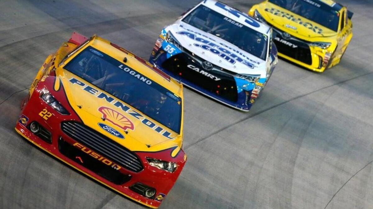 
Joey Logano leads David Ragan and Matt Kenseth during the NASCAR Sprint Cup Series IRWIN Tools Night Race at Bristol Motor Speedway on Saturday in Bristol, Tenn.
