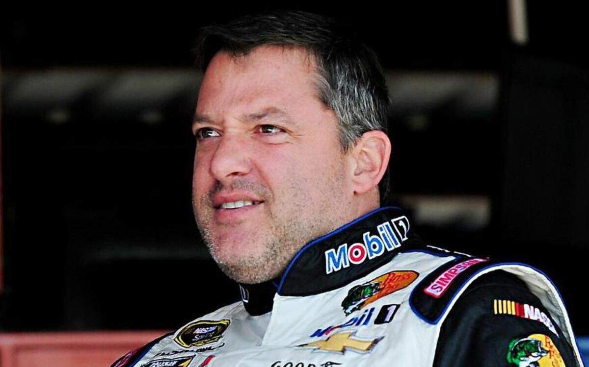 
Tony Stewart, driver of the #14 Mobil 1 / Bass Pro Shops Chevrolet, stands in the garage area during practice for the NASCAR Sprint Cup Series Toyota Owners 400 at Richmond International Raceway on April 24, 2015 in Richmond, Virginia. (Photo by Jeff Curry/Getty Images)
