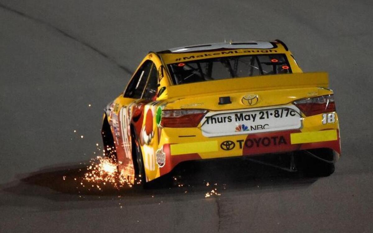 
Sparks fly from the No. 18 M&M’s Red Nose Day Toyota, driven by Erik Jones, during the SpongeBob SquarePants 400 in Kansas City, Kan.
