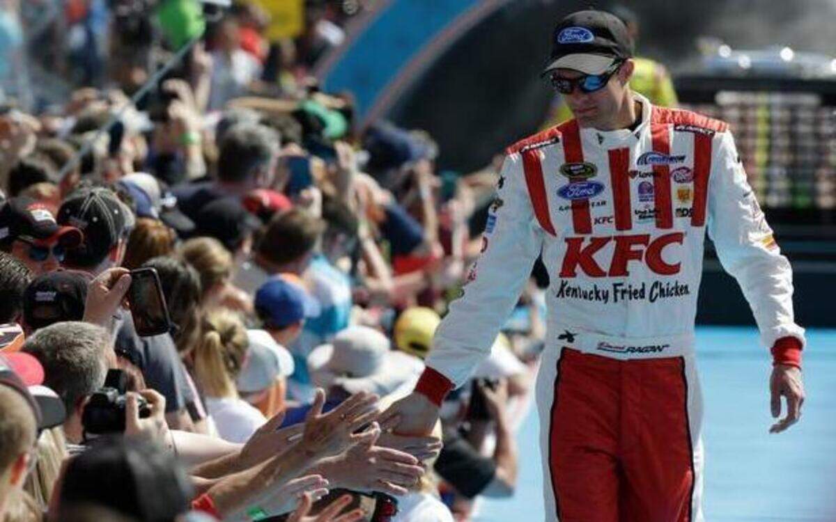 
David Ragan greets fans as he is introduced before the start of the Daytona 500 NASCAR Sprint Cup series auto race at Daytona International Speedway in Daytona Beach, Fla., Sunday, Feb. 22, 2015.
