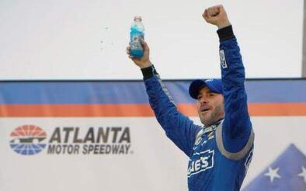 
Jimmie Johnson reacts after winning the NASCAR Sprint Cup auto race at Atlanta Motor Speedway in Hampton, Ga., Sunday, March 1, 2015. 
