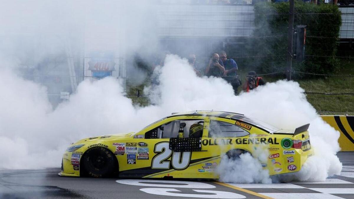 
Matt Kenseth celebrates with a burnout after winning the NASCAR Sprint Cup Series Windows 10 400 at Pocono Raceway on Sunday, Aug. 2, 2015 in Long Pond, Pa.
