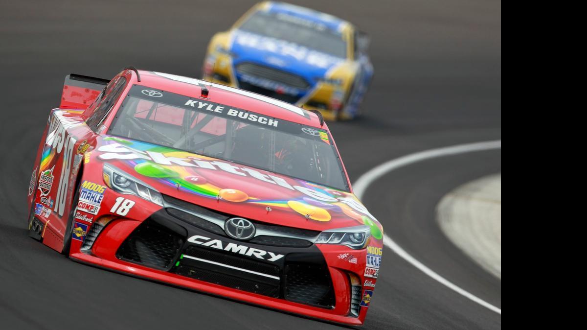 
Kyle Busch leads a pack of cars during the NASCAR Sprint Cup Series Crown Royal Presents the Jeff Kyle 400 at the Brickyard at Indianapolis Motor Speedway on July 26, 2015 in Indianapolis.
