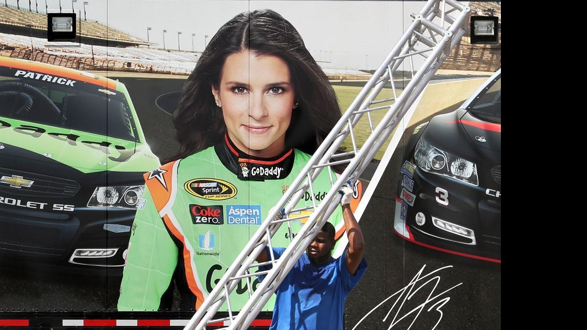 
Workers assemble the Chevrolet fan experience venue at Daytona International Speedway on Wednesday ahead of this weekend's running of the 57th Coke Zero 400 race. 
