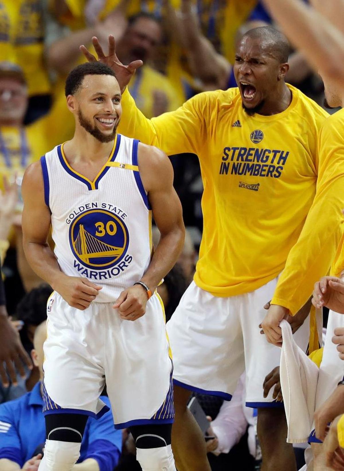 David West, right, celebrates with teammate Stephen Curry during the second round of the NBA playoffs against the Jazz.