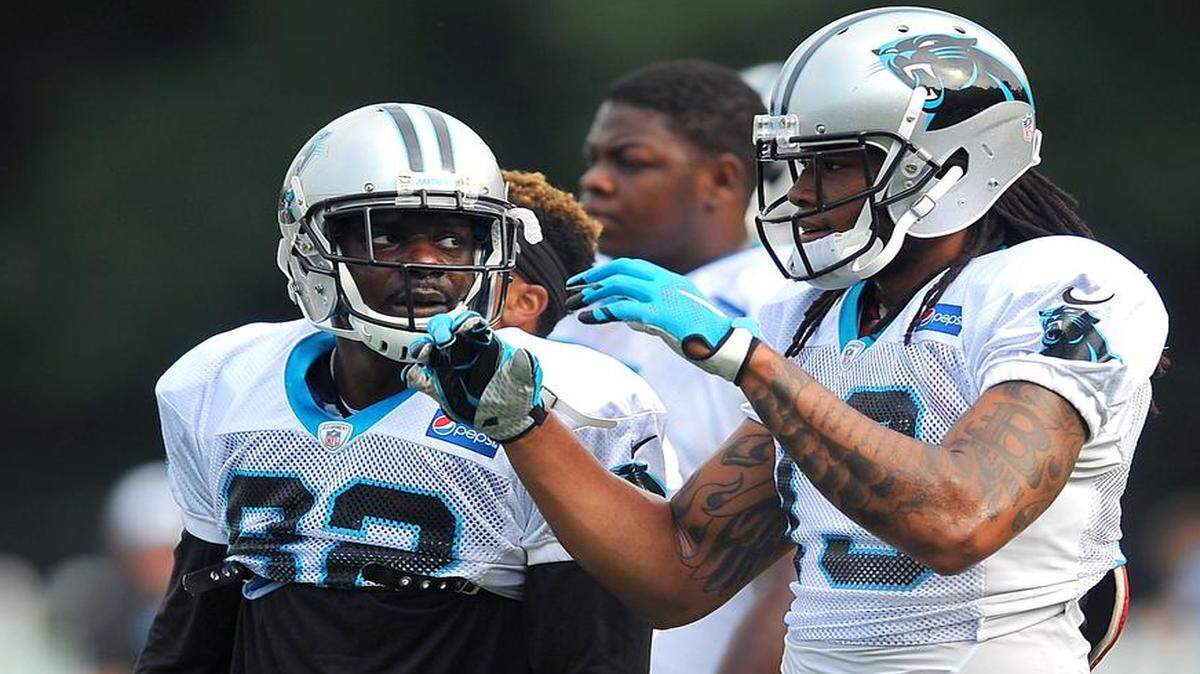 
Carolina Panthers veteran wide receiver Jerricho Cotchery, left, says a big part of his role is mentoring the team’s young receivers, such as Kelvin Benjamin, right.
